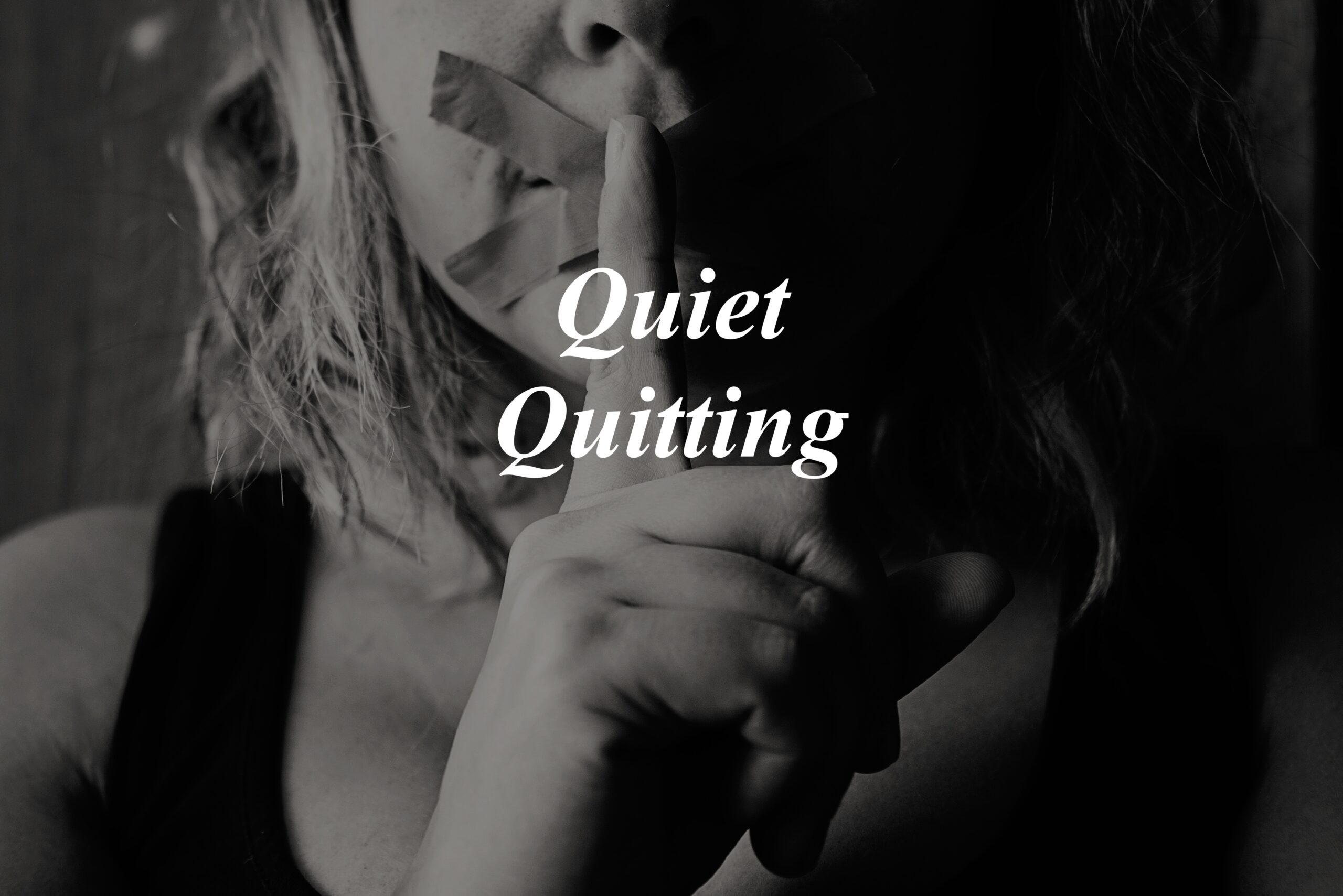 quiet quitting, quiet hiring quiet firing, person with finger to the mouth